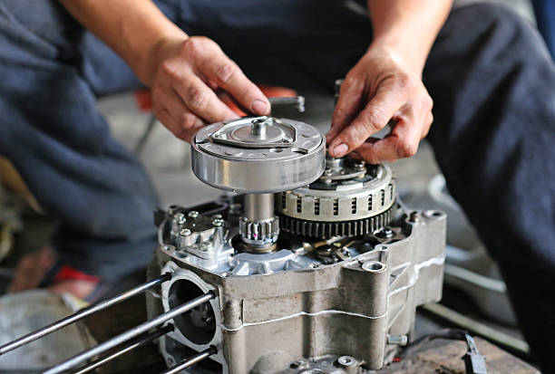 istock pair of technician hand fixing the motorcycle 626195322