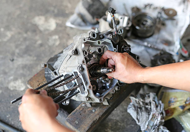 istock pair of technician hand fixing the motorcycle 626196808