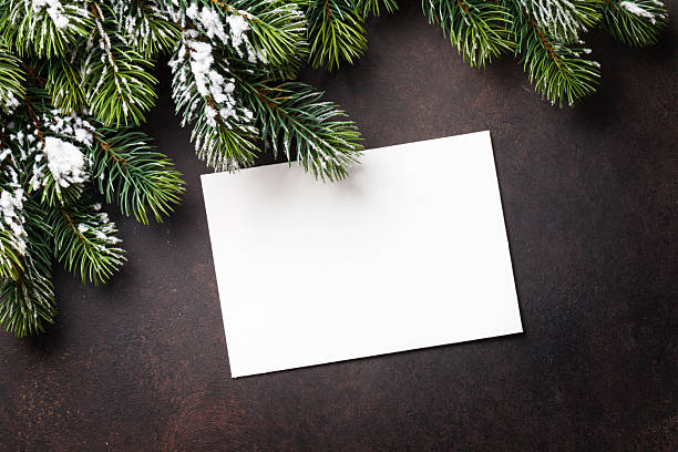 istock Christmas greeting card and fir tree over stone background 626196882
