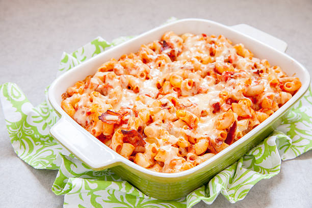 istock Pasta casserole with bacon, ham, cheese and tomato 626197184