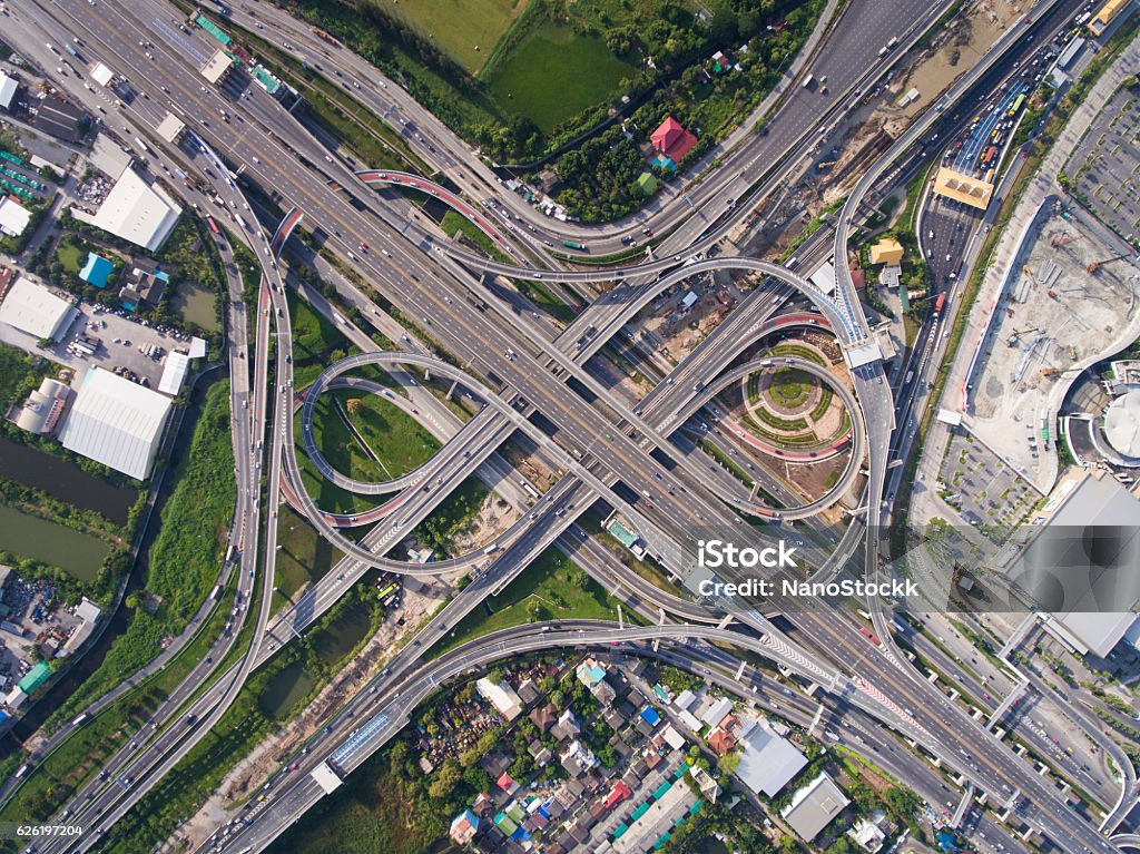 Busy highway junction from aerial view Aerial highway junction. Busy highway from aerial view. Highway shape like number 8 and infinity sign. Urban highway and lifestyle concept. Highway taken in the eastern highway of Bangkok Thailand. Top - Garment Stock Photo