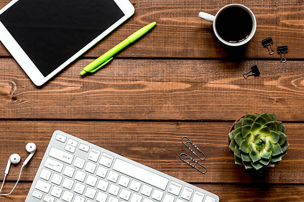 istock mans working place at wooden desktop with coffee 626197260
