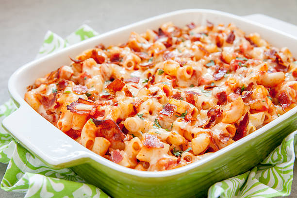 istock Pasta casserole with bacon, ham, cheese and tomato 626197392