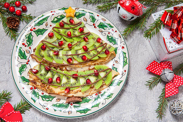 istock Funny Christmas tree shaped sweet pancakes crepes for breakfast 626198412