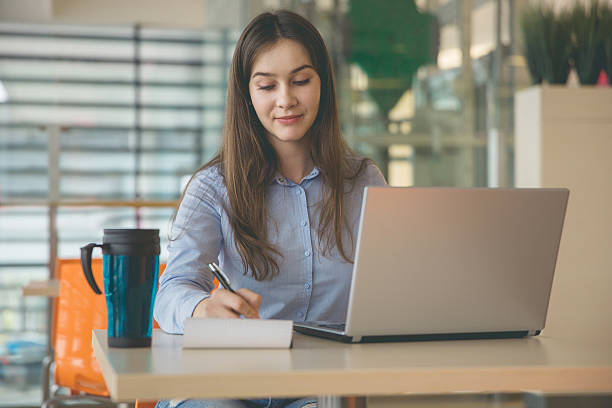 istock Woman working remotely at cafe 626203796