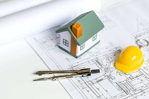 istock architect tools on white background with drawings apartments top view 626203924