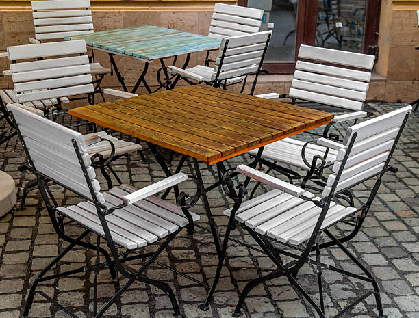 istock Wooden table and white and black chairs in the cafe 626207098