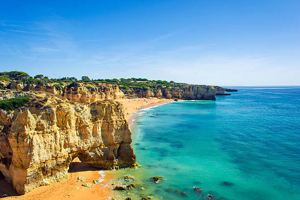 view of beautiful sandy beach Dona Ana in Lagos view of beautiful sandy beach Dona Ana in Lagos, Algarve region, Portugal lagos portugal stock pictures, royalty-free photos & images