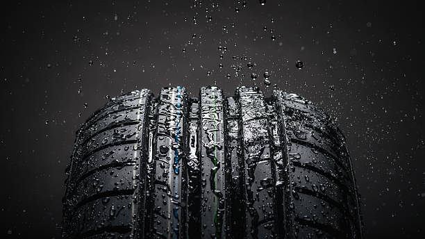 istock Water splashing on tire during the rain 626207888