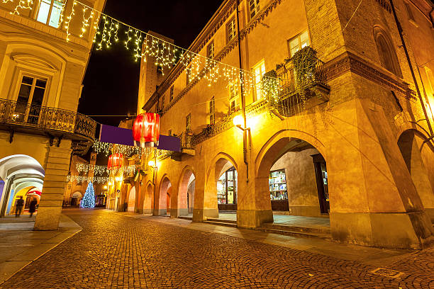 istock Decorated evening street in Alba, Italy. 626208732
