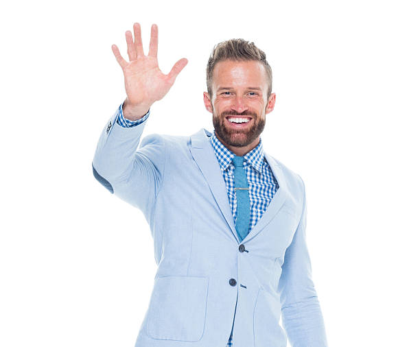 istock Smiling businessman waving hand 626214302