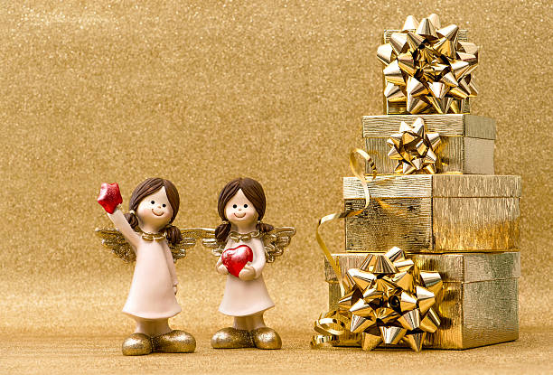 istock Gift boxes little guardian angels Christmas holidays decoration 626214664
