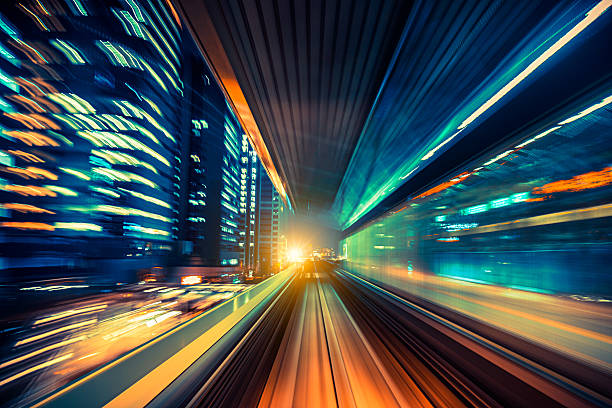 abstract motion-blurred view from a moving train abstract motion-blurred view from the front of a train in Tokio, Japan light commercial vehicle stock pictures, royalty-free photos & images