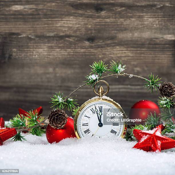 Christmas Decoration Antique Golden Clock Red Ornaments Snow Stock Photo - Download Image Now