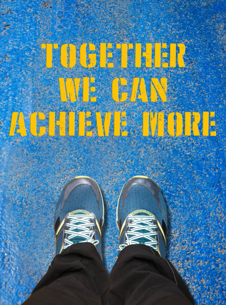 istock TOGETHER WE CAN ACHIEVE MORE , feet and words concept 626218246