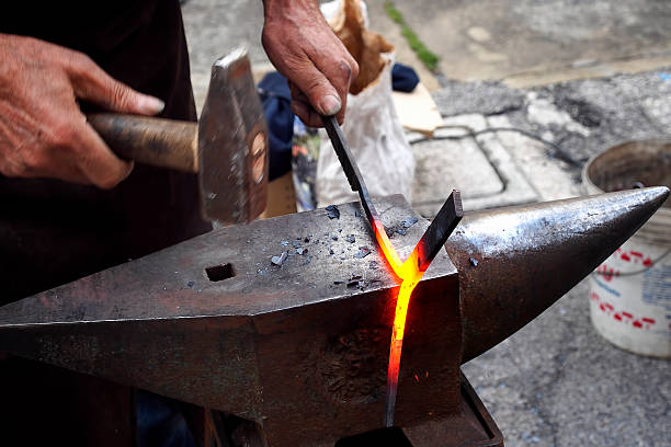 Blacksmith in action stock photo