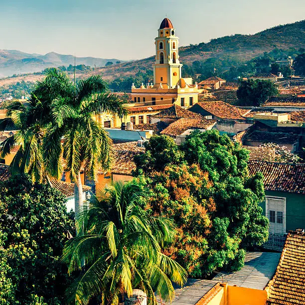 Panoramic view over the city of Trinidad, Cuba with mountains in the background and a blue sky