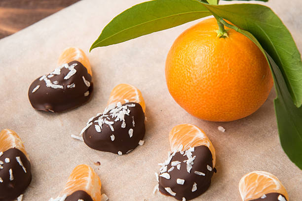 Chocolate-dipped tangerine slices with coconut