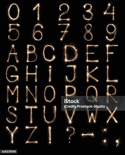 English Letters From Sparklers Alphabet And Numbers On Black Background Stock Photo - Download Image Now