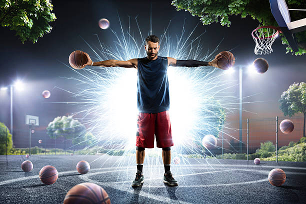 istock Basketball player is holding two balls in his hands 626231814