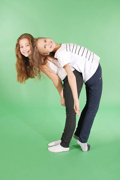 istock Two friends school girls back to back 626232188