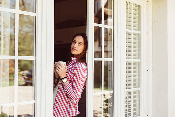 istock Relaxed woman drinking coffee at home 626232322