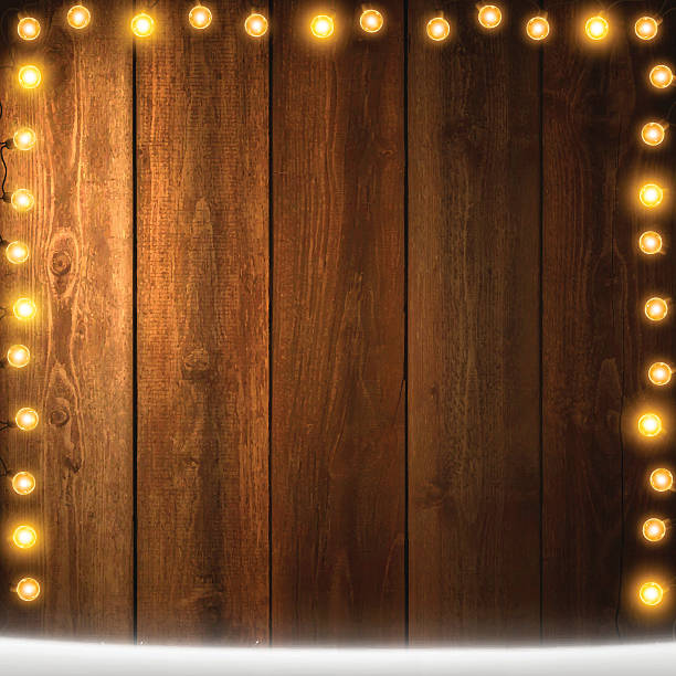 istock Christmas Lights on lit blank wooden background with snow 626234308