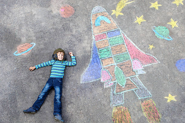 istock little kid boy flying by a space shuttle chalks picture 626234620