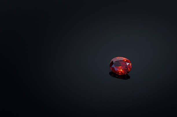 Red Ruby gem on black shine table, Color filter stock photo