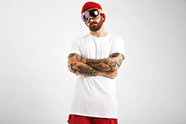 istock Tattooed and bearded snowboarder in blank white t-shirt 626244112