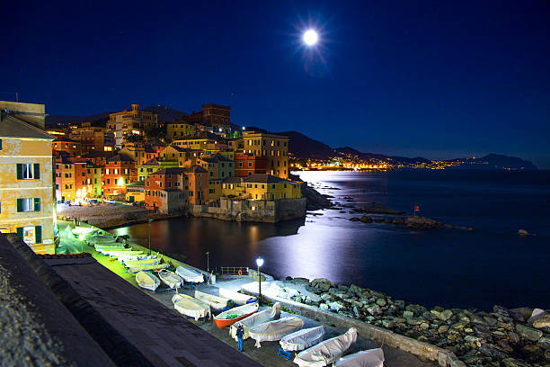 istock Genoa Boccadasse, Italy by night while watching the large moon 626244956