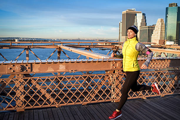 istock Female athlete jogging on the bridge 626245484