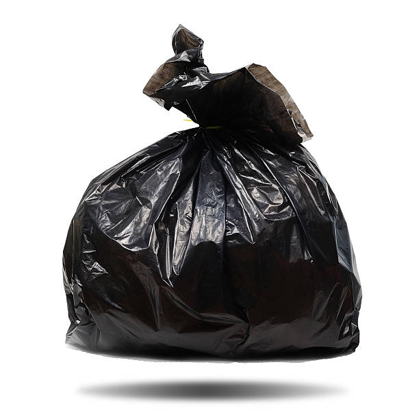 istock Single black plastic garbage bag on white background, clipping p 626245758