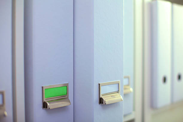 istock File folders, standing on  shelves in the background 626246484