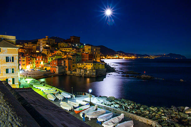 istock Genoa Boccadasse, Italy by night while watching the large moon 626246542