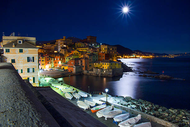 istock Genoa Boccadasse, Italy by night while watching the large moon 626247466