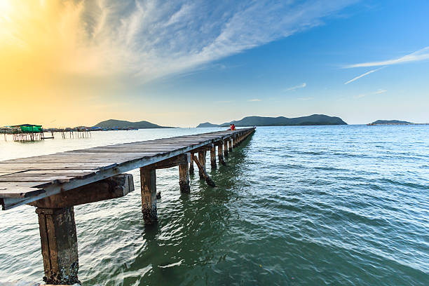 istock Beautiful sky and wooden bridge pier with twilight sky 626248582