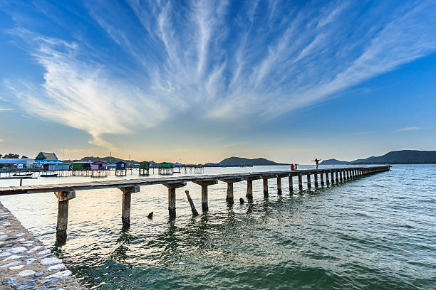 istock Beautiful sky and wooden bridge pier with twilight sky 626248700