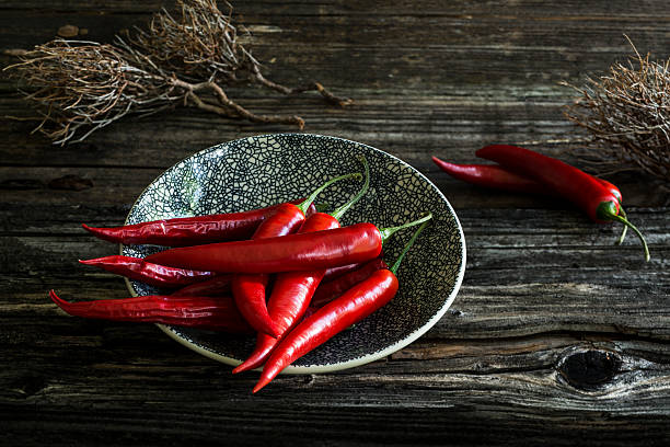 istock Red pepperoni on old wood 626248756