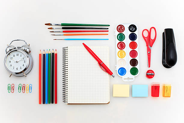 istock School set with notebooks, pencils, brush, scissors and apple on 626254696