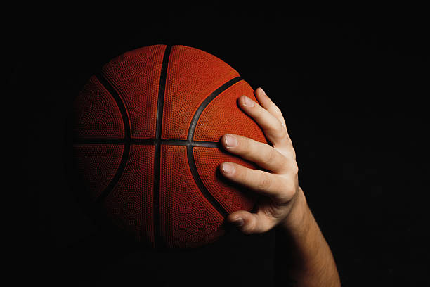 istock Basketball ball in male hands 626255966