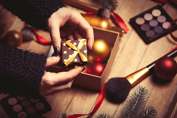 istock Female hands are wrapping cosmetics 626256372