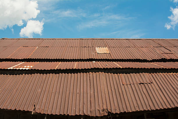 istock old zinc roof texture with blue sky. 626256618