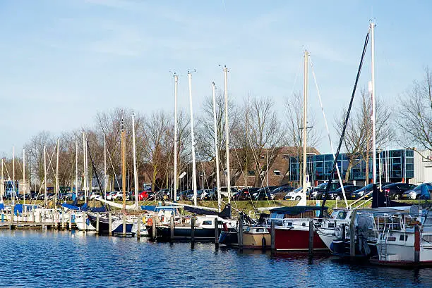 Boats in the old Huizen Harbor in Holland