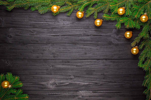 istock Christmas fir tree on black wooden background 626258752