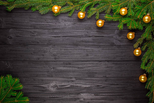 istock Christmas fir tree on black wooden background 626258884