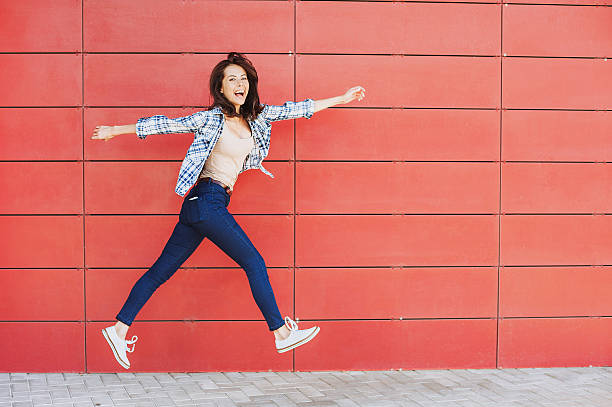 istock Jumping happy girl 626259690