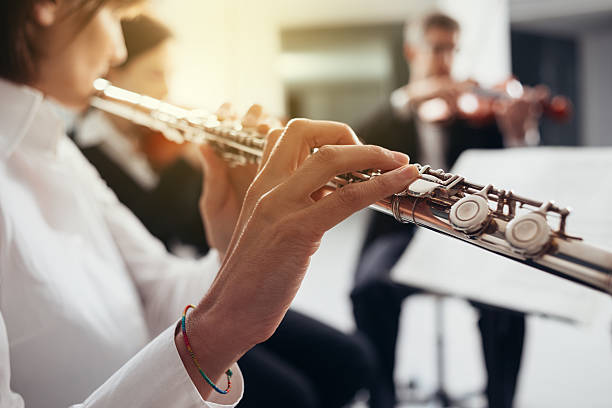 istock Flutist playing her instrument on stage 626260000