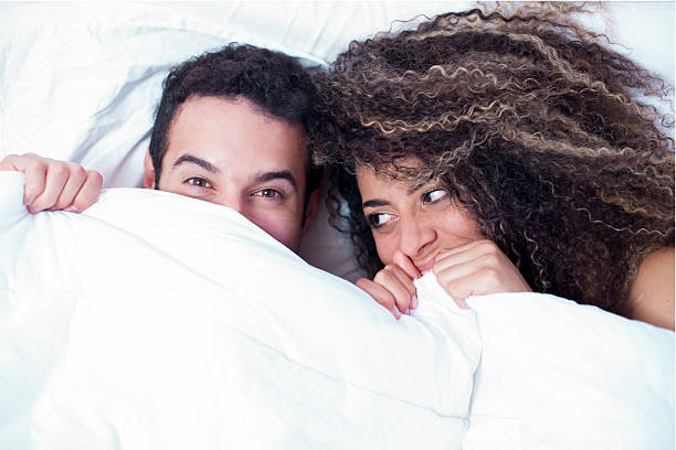 couple happy under the sheets - funnyface imagens e fotografias de stock