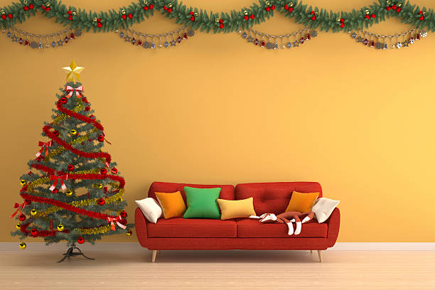 istock christmas tree in yellow living room with red sofa 626260230